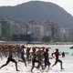 Triathletes enter the water during the Rio Olympics. Photo credit: Bryn Lennon/Getty